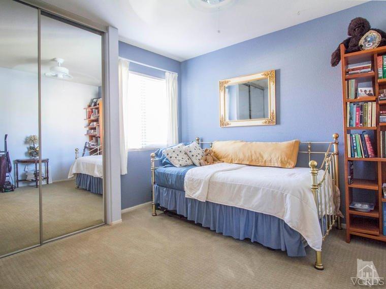 15310 Rains Court Moorpark, CA 93021 - Photo 24 of 29 a bedroom with a bed and a book shelf