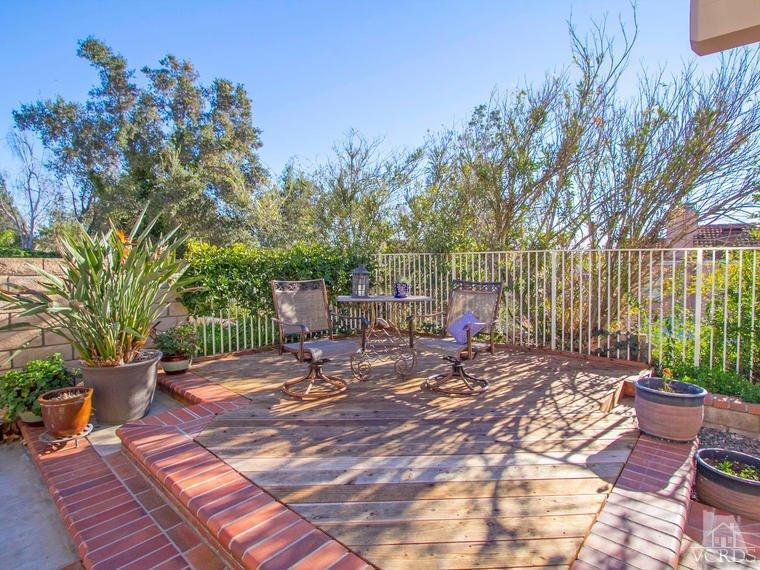 15310 Rains Court Moorpark, CA 93021 - Photo 28 of 29 a view of a patio with a table and chairs and potted plants