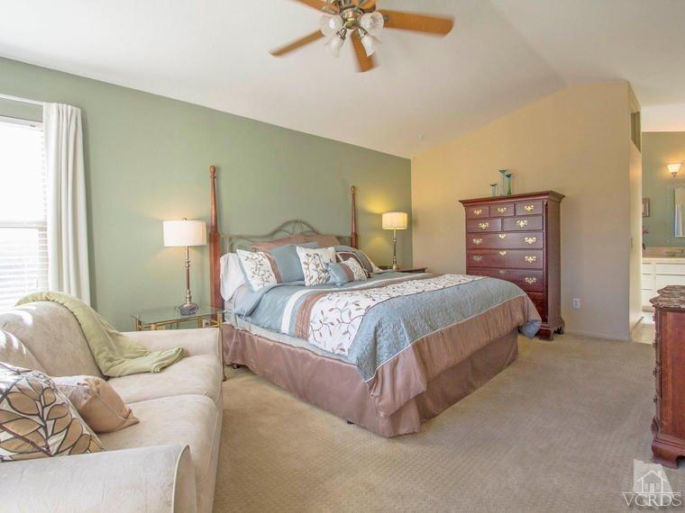 15310 Rains Court Moorpark, CA 93021 - Photo 5 of 29 a bedroom with a bed couch and window