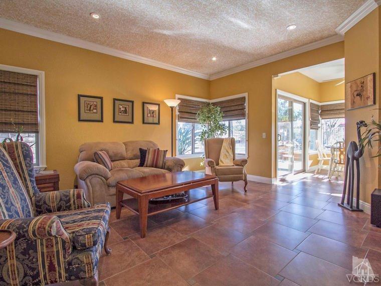 15310 Rains Court Moorpark, CA 93021 - Photo 9 of 29 a living room with furniture and a floor to ceiling window