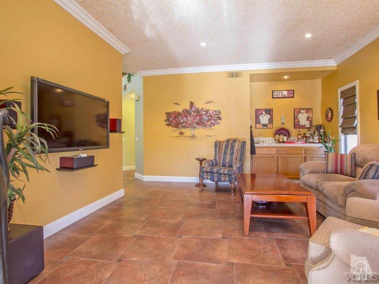 15310 Rains Court Moorpark, CA 93021 - Photo 10 of 29 a living room with furniture and a flat screen tv