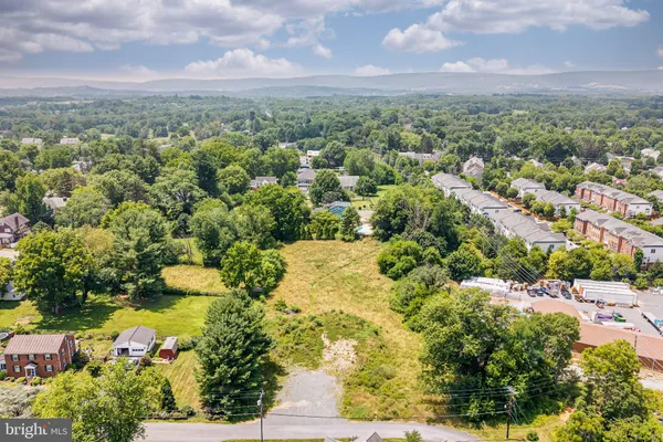 an aerial view of a houses with yard