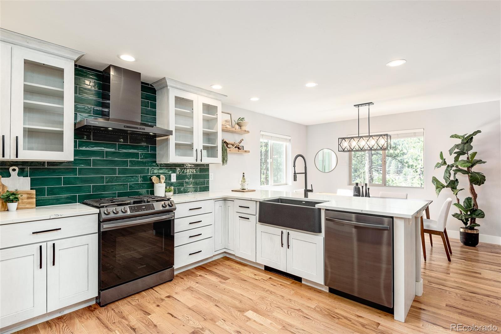 5132 Ute Road Indian Hills, CO 80454 - Photo 17 of 38 a kitchen with a sink stove and cabinets