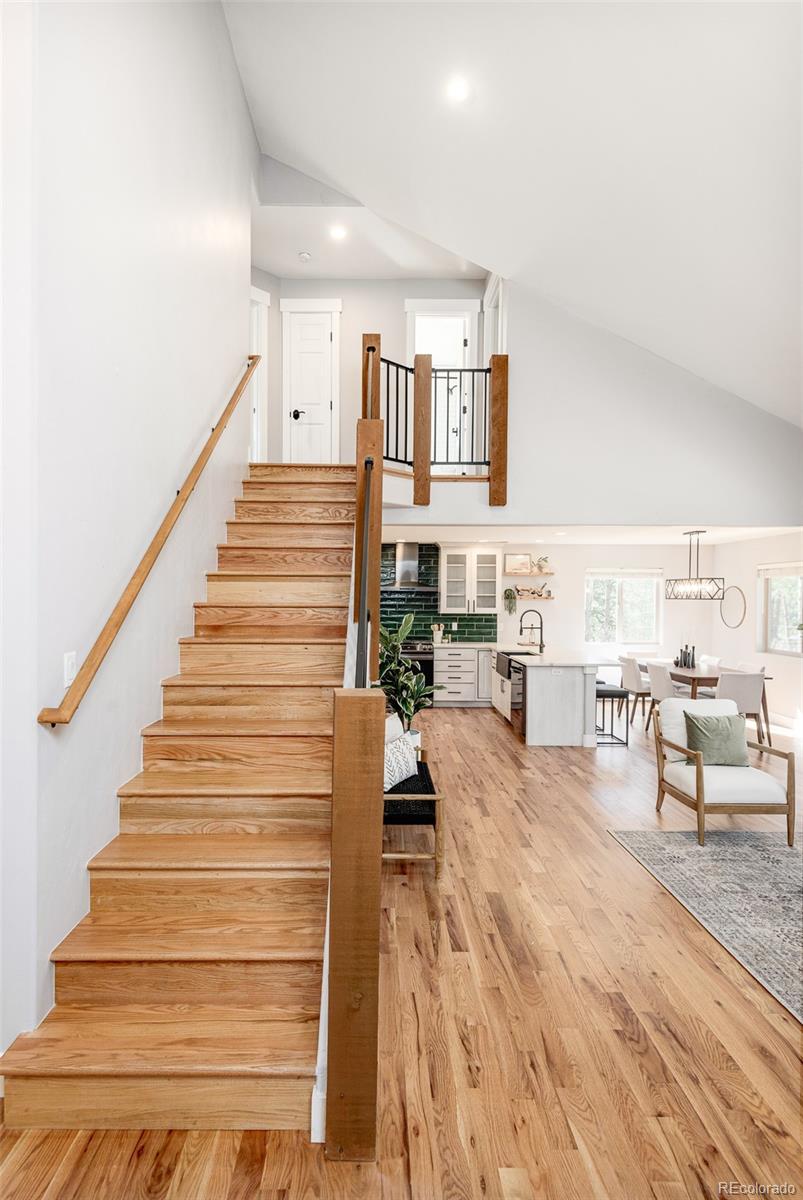 5132 Ute Road Indian Hills, CO 80454 - Photo 27 of 38 a view of entryway and hall with wooden floor