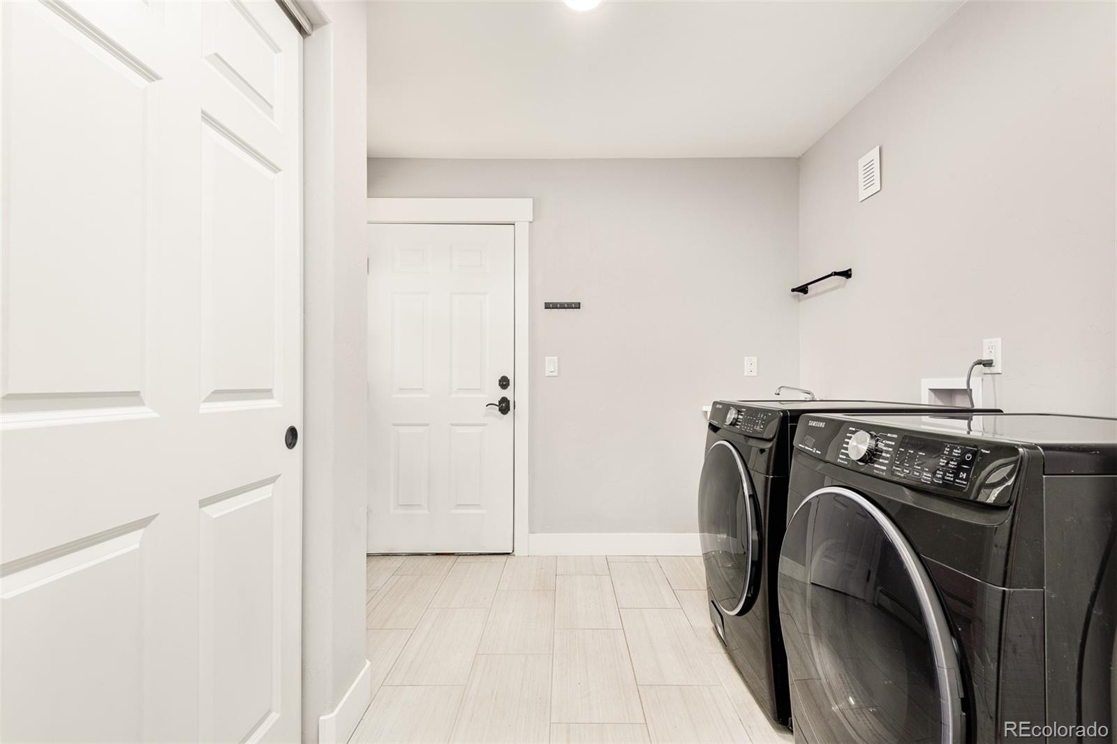 5132 Ute Road Indian Hills, CO 80454 - Photo 34 of 38 a utility room with dryer and washer
