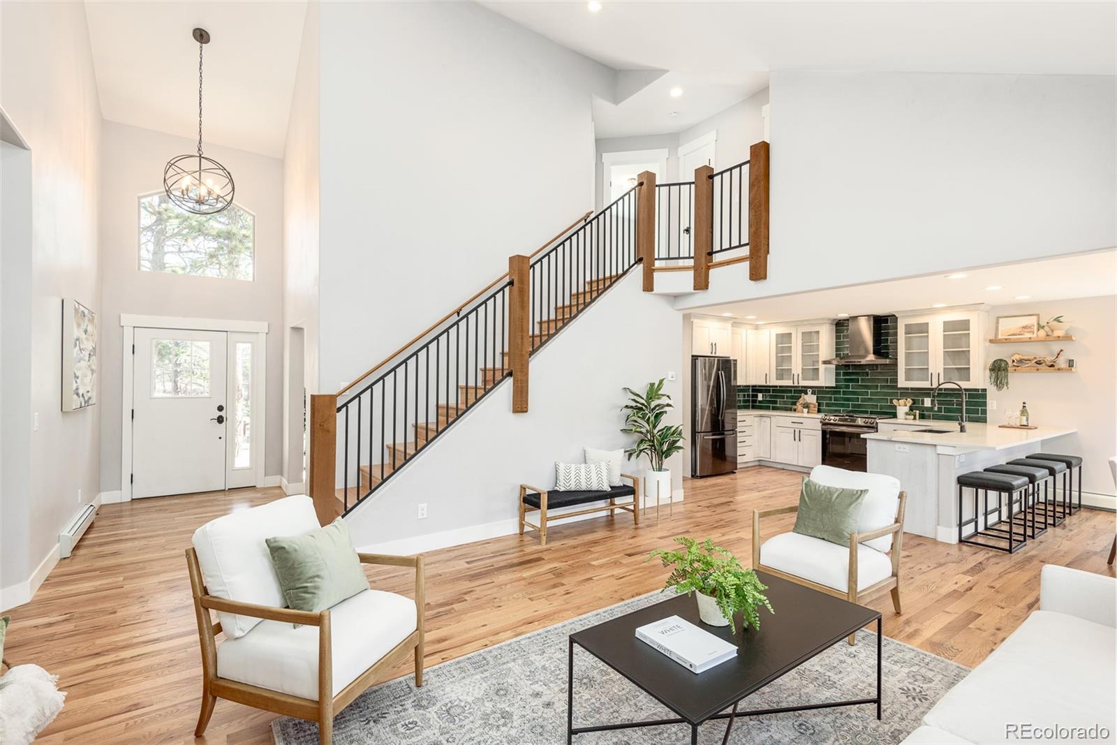 5132 Ute Road Indian Hills, CO 80454 - Photo 7 of 38 a view of a livingroom with furniture wooden floor and windows