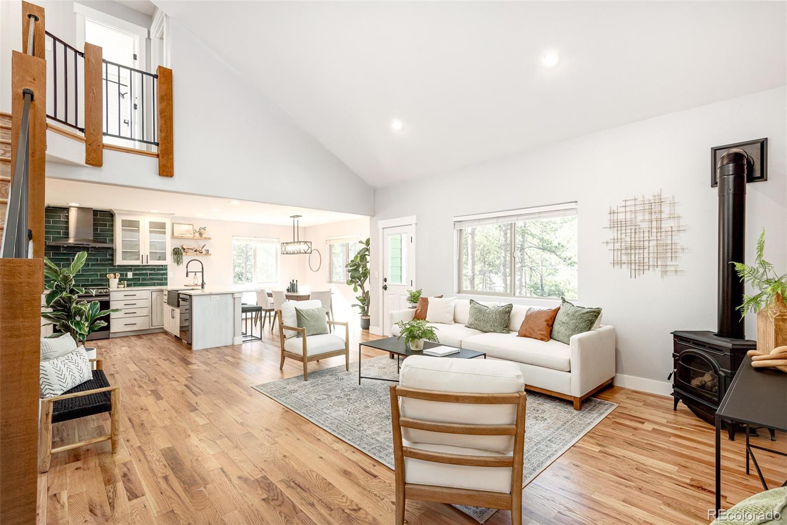 5132 Ute Road Indian Hills, CO 80454 - Photo 9 of 38 a living room with furniture large window and wooden floor