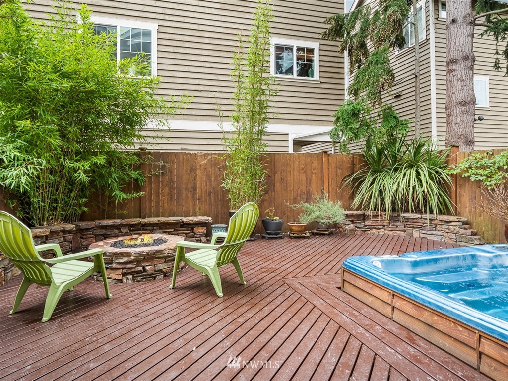 1212 North 85th Street, Unit B Seattle, WA 98103 - Photo 1 of 28 a view of a lounge chairs in back of the house