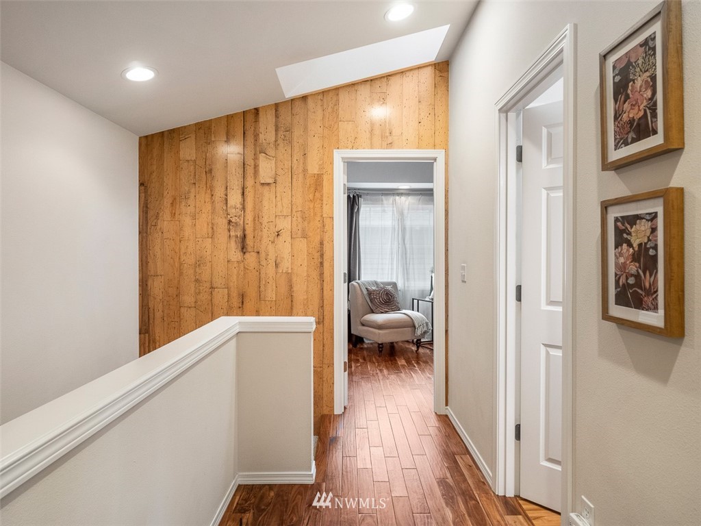 1212 North 85th Street, Unit B Seattle, WA 98103 - Photo 16 of 28 a very nice looking room with wooden floor