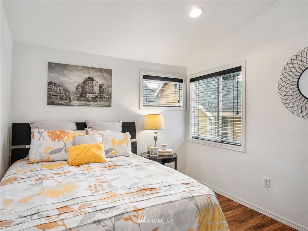 1212 North 85th Street, Unit B Seattle, WA 98103 - Photo 19 of 28 a bedroom with a bed and a window