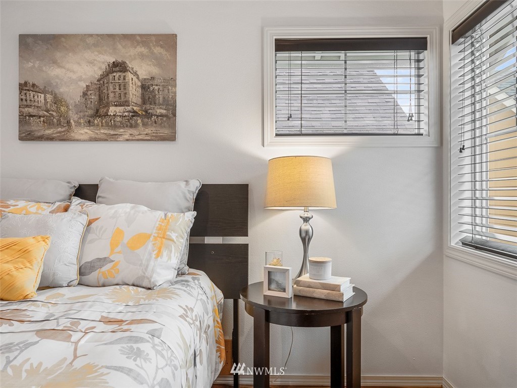 1212 North 85th Street, Unit B Seattle, WA 98103 - Photo 20 of 28 a bedroom with a bed and a window