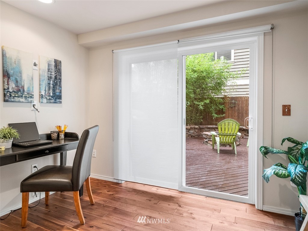 1212 North 85th Street, Unit B Seattle, WA 98103 - Photo 22 of 28 a view of a dining room with furniture window and wooden floor