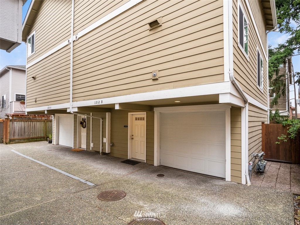 1212 North 85th Street, Unit B Seattle, WA 98103 - Photo 24 of 28 a view of a house with a garage