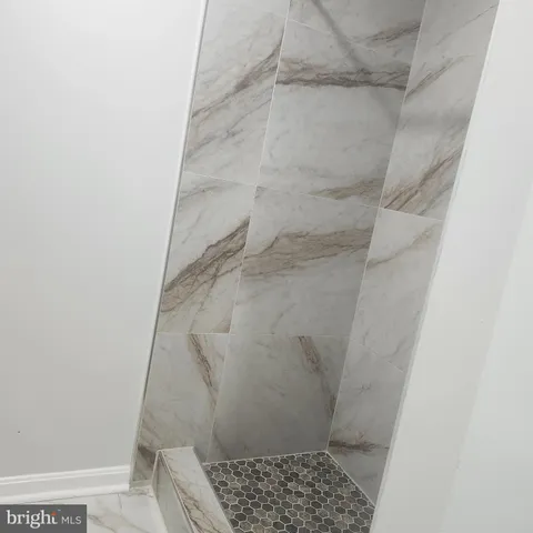 a living room with a couch and a flat screen tv