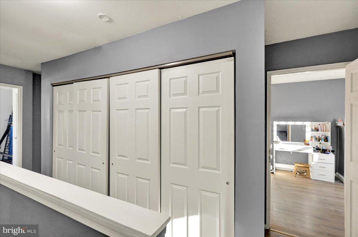 1118 Fox Run Reading, PA 19606 - Photo 11 of 19 a view of a hallway with wooden floor and a bathroom