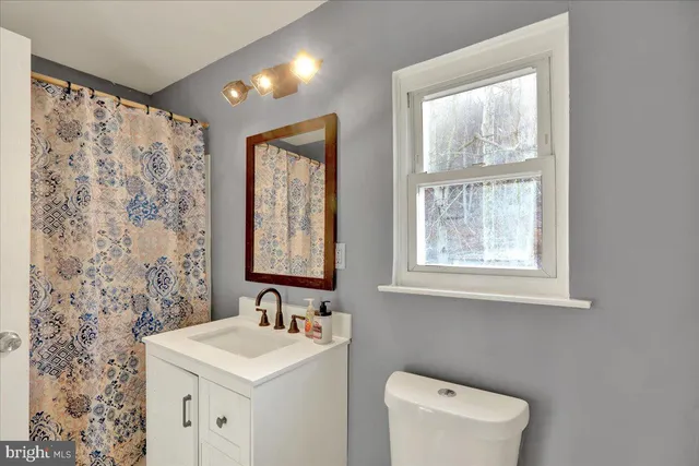 a bedroom with a bed and a cabinets