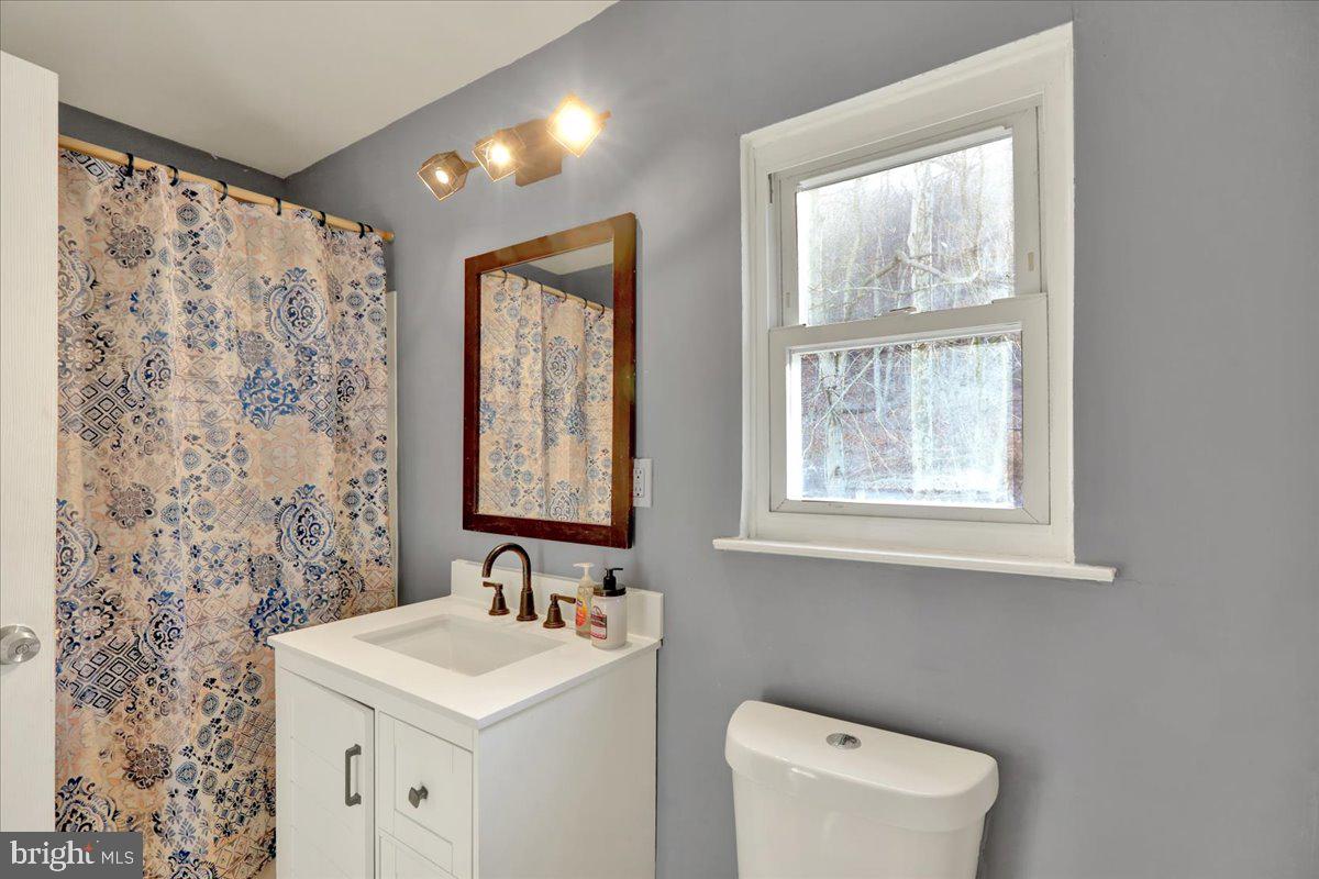 1118 Fox Run Reading, PA 19606 - Photo 12 of 19 a bathroom with a sink a toilet and a window