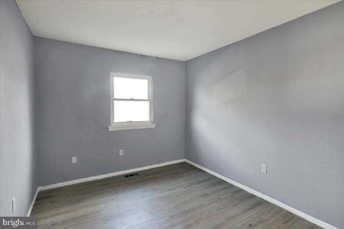1118 Fox Run Reading, PA 19606 - Photo 17 of 19 wooden floor in an empty room with a window