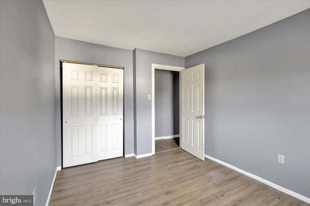 1118 Fox Run Reading, PA 19606 - Photo 18 of 19 an empty room with wooden floor and windows