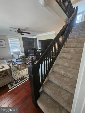 a kitchen with stainless steel appliances granite countertop a refrigerator sink and stove