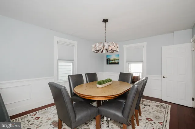 a kitchen with stainless steel appliances granite countertop a refrigerator sink and stove