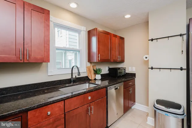 a white toilet sitting next to a shower curtain