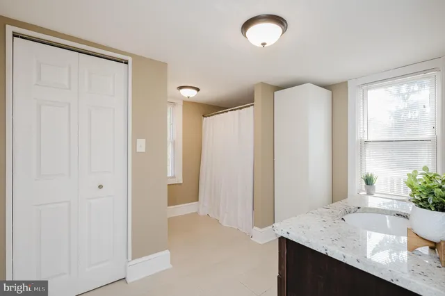 a living room with furniture a walk in closet