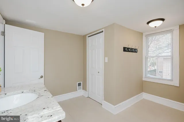 a view of a balcony with wooden fence