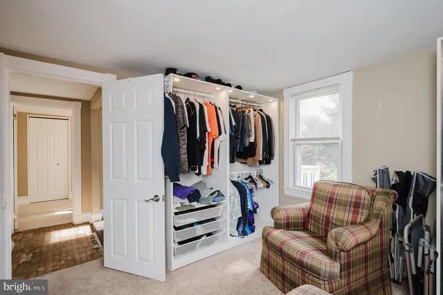 a view of a patio with table and chairs with wooden fence and plants