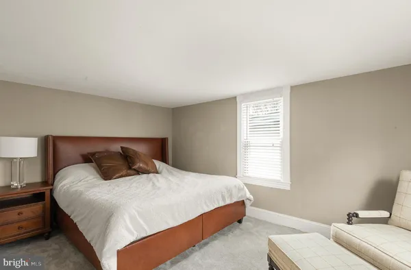 a view of a patio with table and chairs with wooden fence and plants