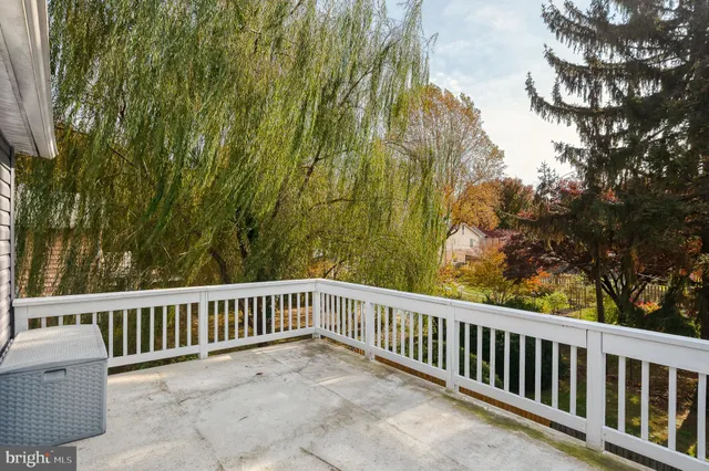 a front view of a house with a garden and plants
