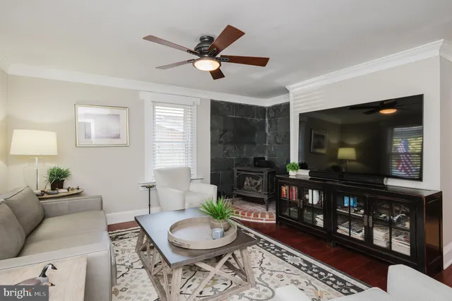 a view of a dining room with furniture wooden floor and a chandelier