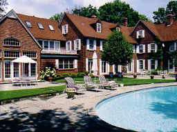 Undisclosed Address Glencoe, IL 60022 - Photo 1 of 1 a front view of a residential apartment building with a yard