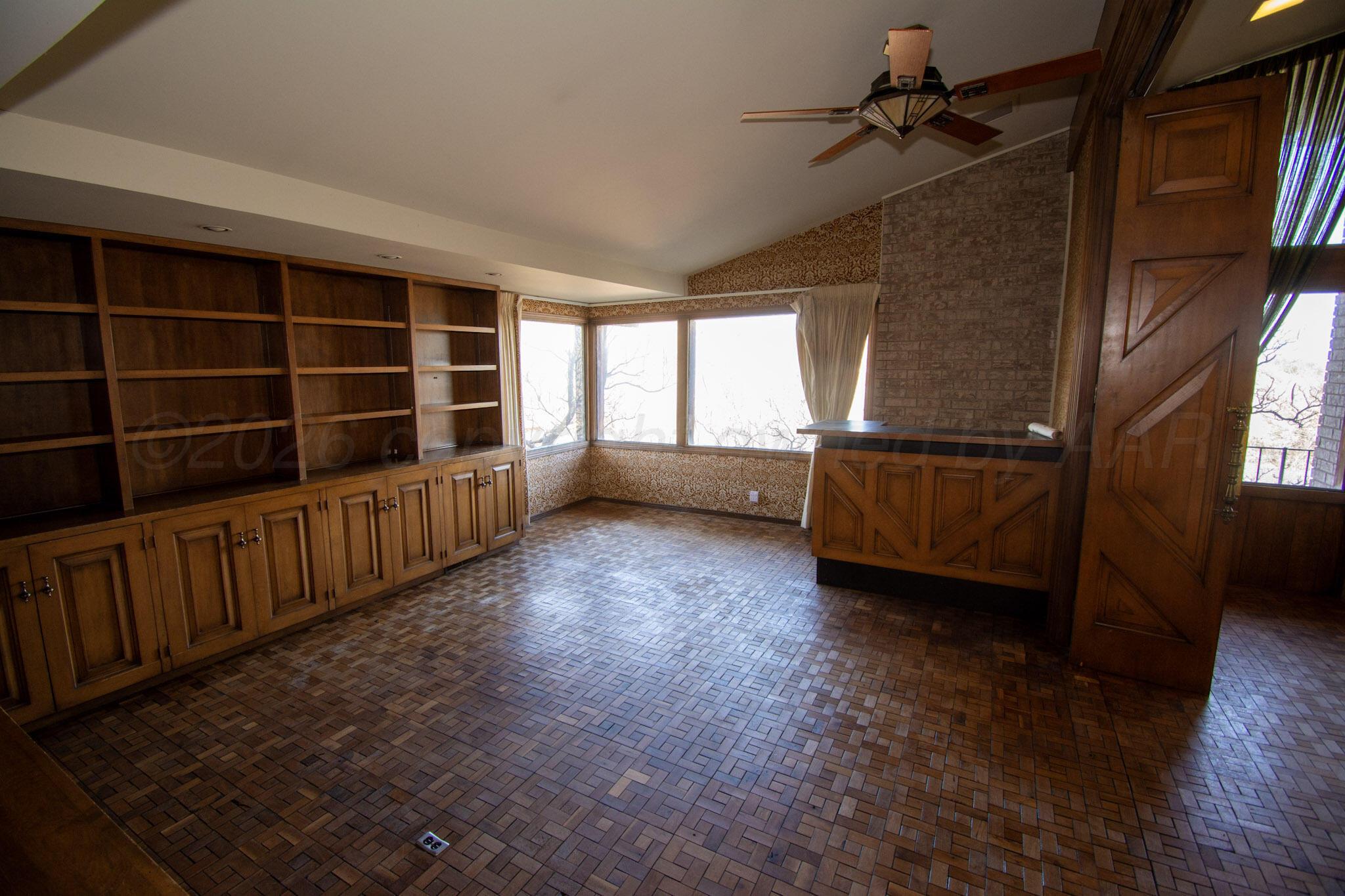 4 Windsor Road Amarillo, TX 79124 - Photo 15 of 41 wooden floor in an empty room with a window