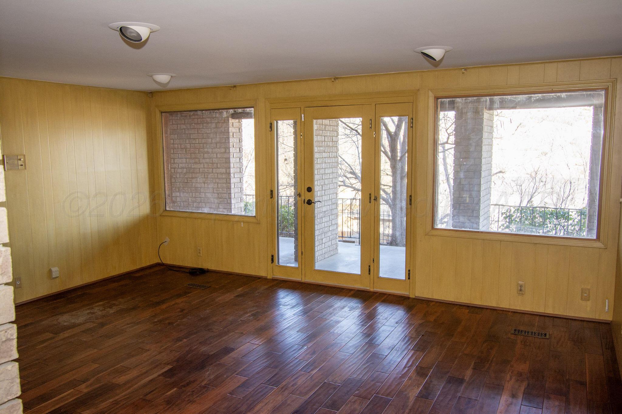 4 Windsor Road Amarillo, TX 79124 - Photo 20 of 41 a view of an empty room with wooden floor and a window