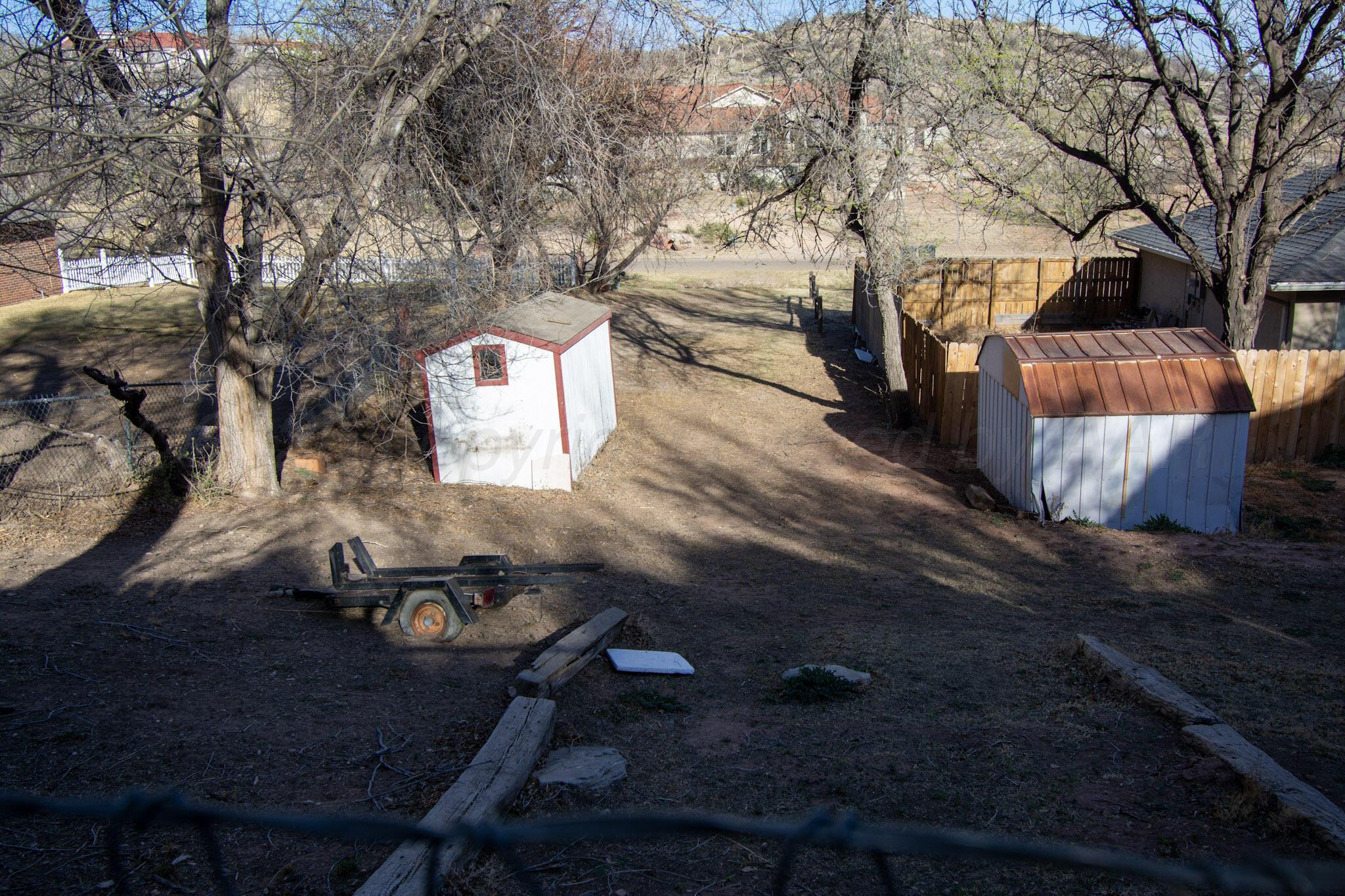 4 Windsor Road Amarillo, TX 79124 - Photo 37 of 41 a backyard of a house with table and chairs