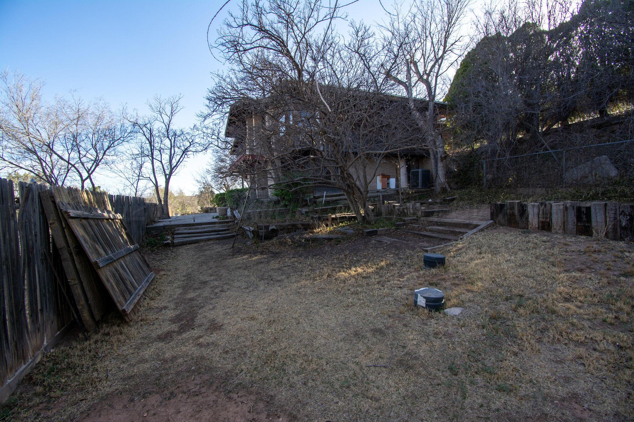 4 Windsor Road Amarillo, TX 79124 - Photo 38 of 41 a view of a backyard with a large tree