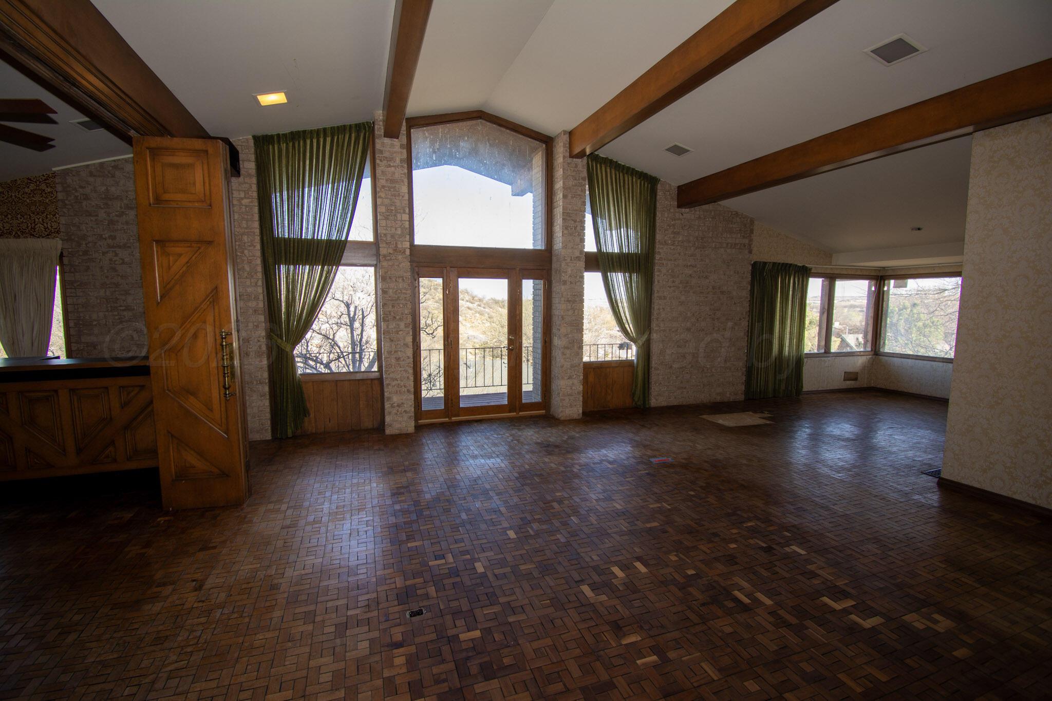 4 Windsor Road Amarillo, TX 79124 - Photo 4 of 41 an empty room with wooden floor and windows