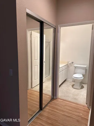 a view of a bathroom from a hallway