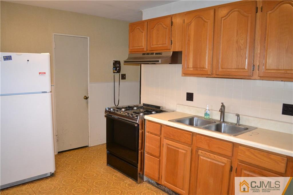 2 Dayton Road Edison, NJ 08817 - Photo 4 of 15 a kitchen with stainless steel appliances granite countertop a refrigerator and a sink