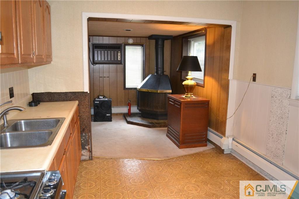 2 Dayton Road Edison, NJ 08817 - Photo 5 of 15 a living room with furniture and a sink