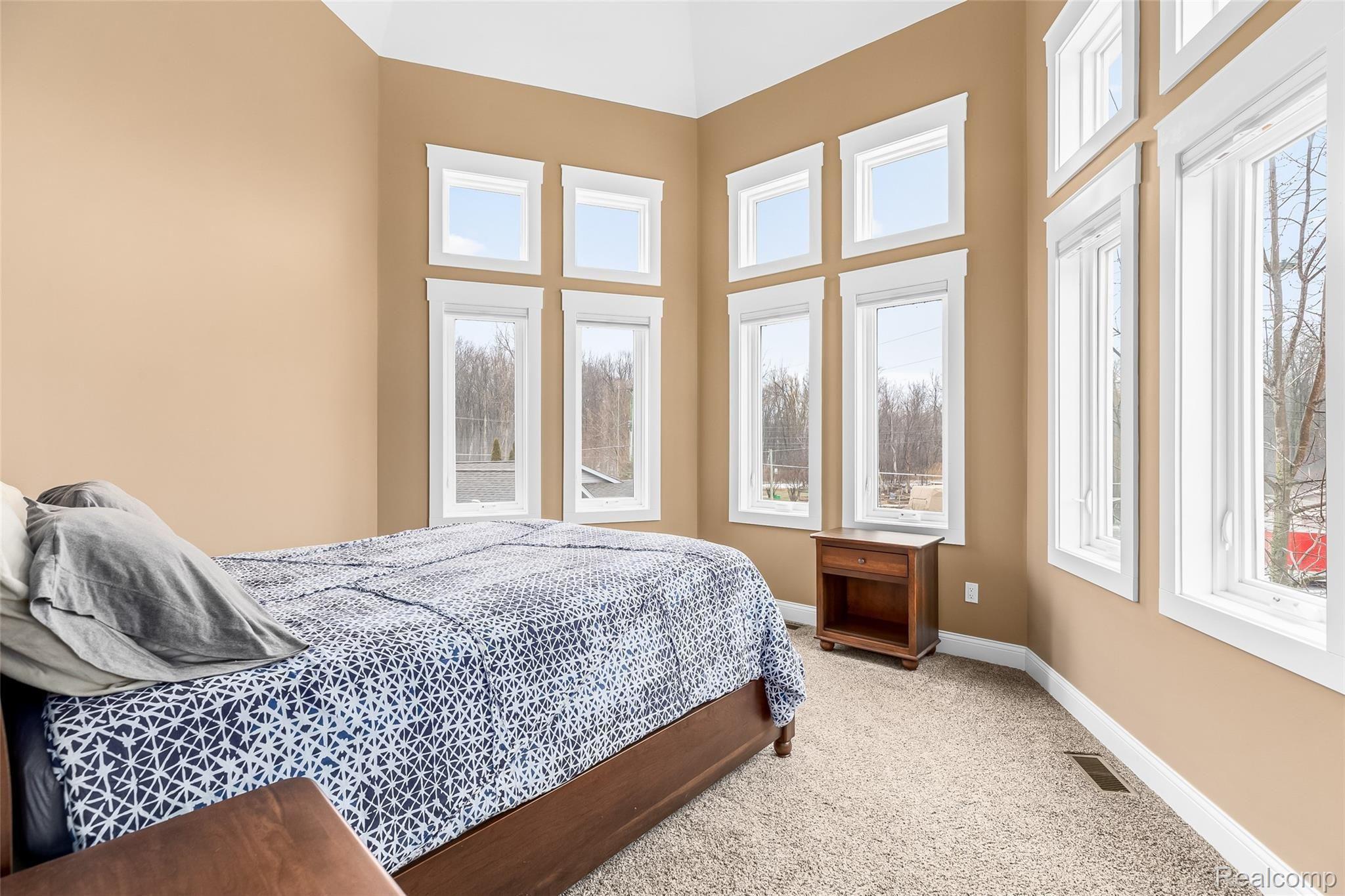 10136 Buhl Road Pinckney, MI 48169 - Photo 30 of 54 Bedroom 2 with large windows overlooking the front yard