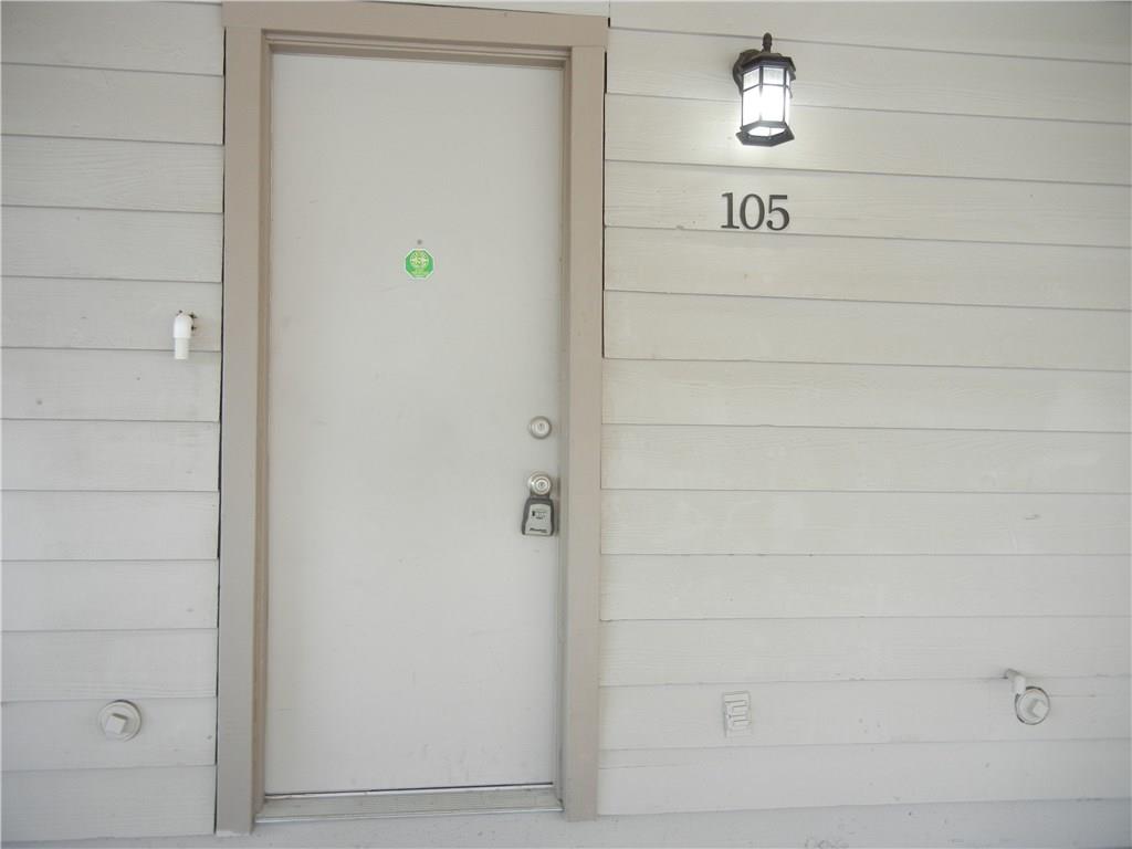 18240 Midway Road, Unit 105 Dallas, TX 75287 - Photo 32 of 37 Entry from Carport