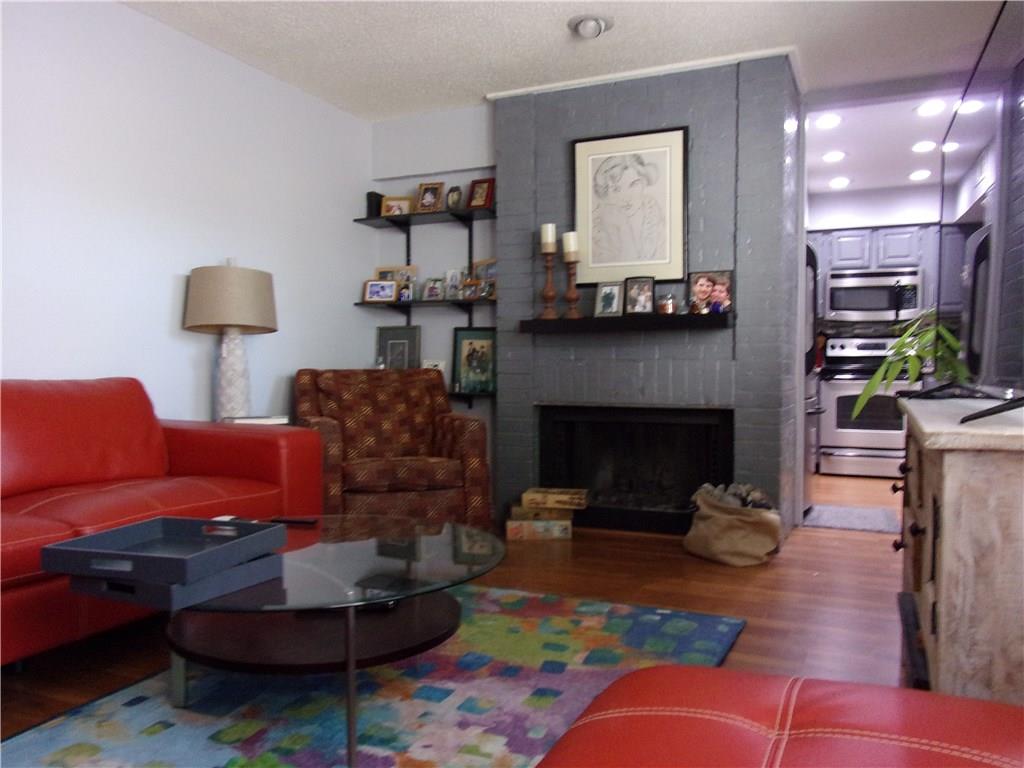 18240 Midway Road, Unit 105 Dallas, TX 75287 - Photo 8 of 37 Large Living Room with Fire Place