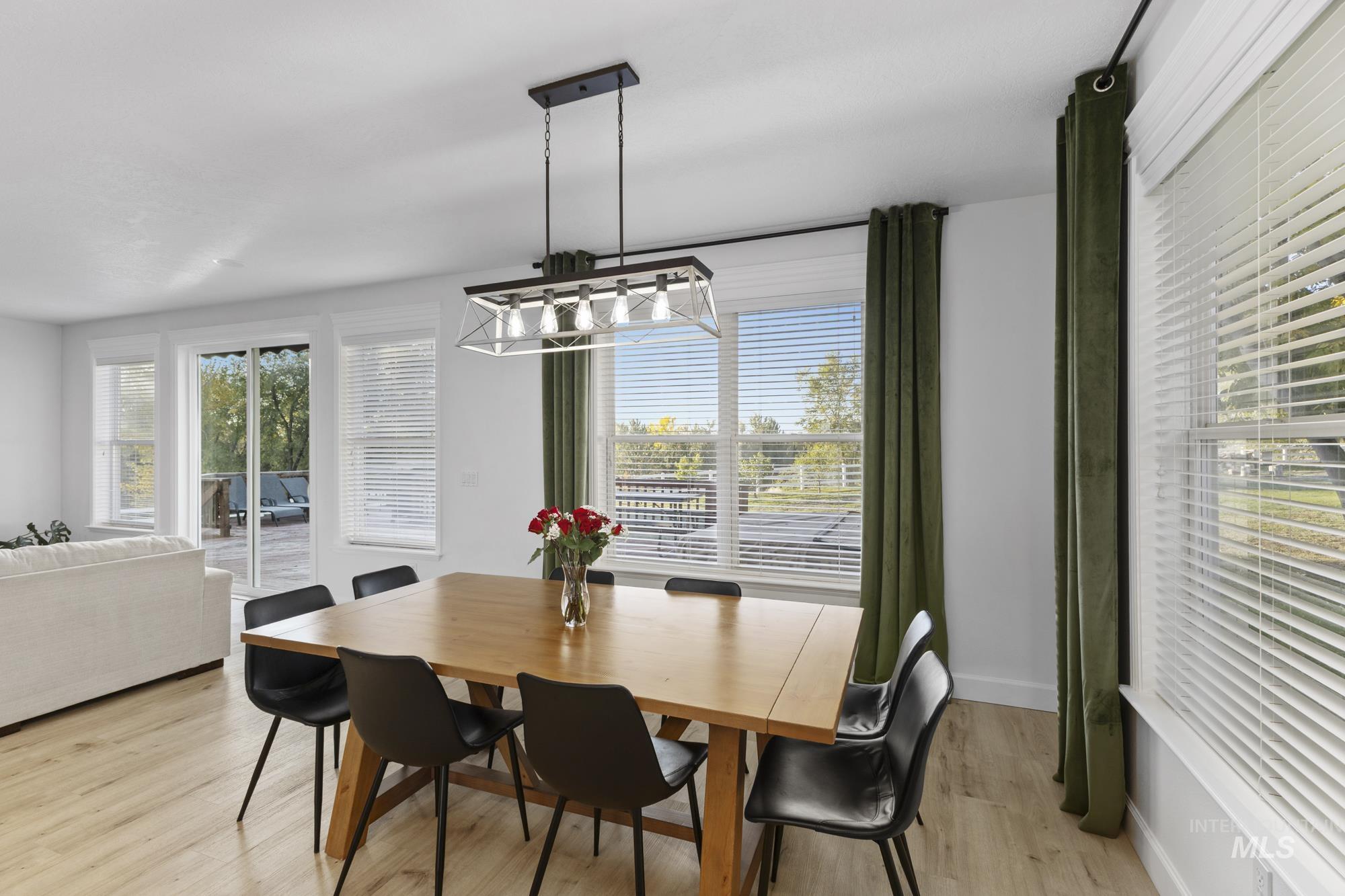 14820 Worden Way Caldwell, ID 83607 - Photo 16 of 44 Dining area with light wood-style floors and a chandelier