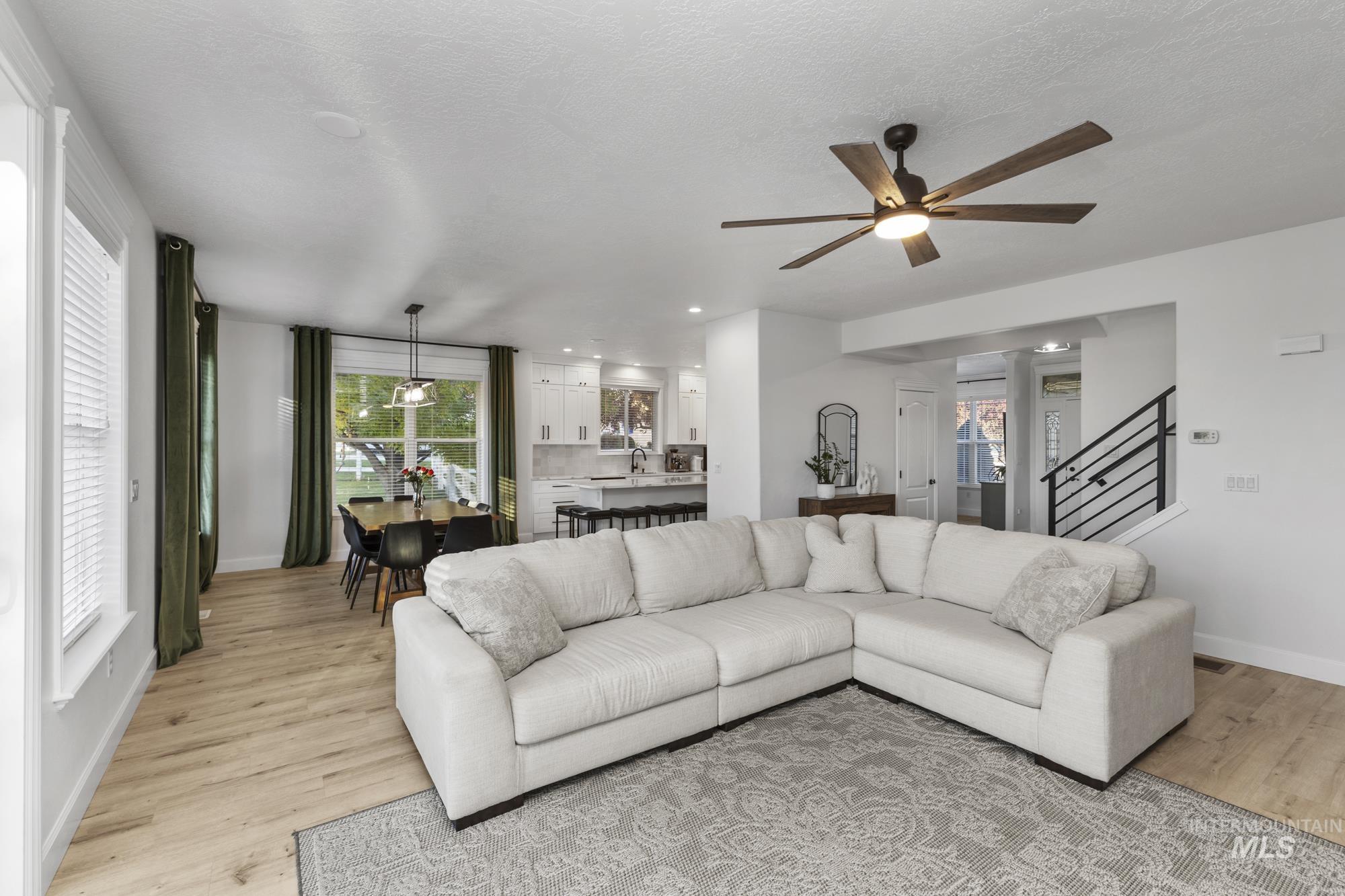 14820 Worden Way Caldwell, ID 83607 - Photo 20 of 44 Living room with light wood-style flooring, a ceiling fan, and recessed lighting