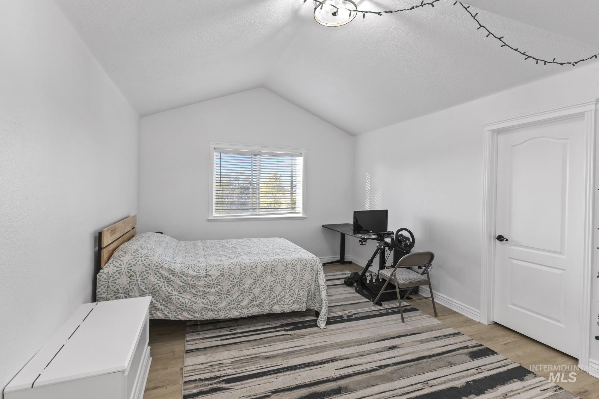 14820 Worden Way Caldwell, ID 83607 - Photo 33 of 44 Bedroom featuring light wood-style flooring and baseboards