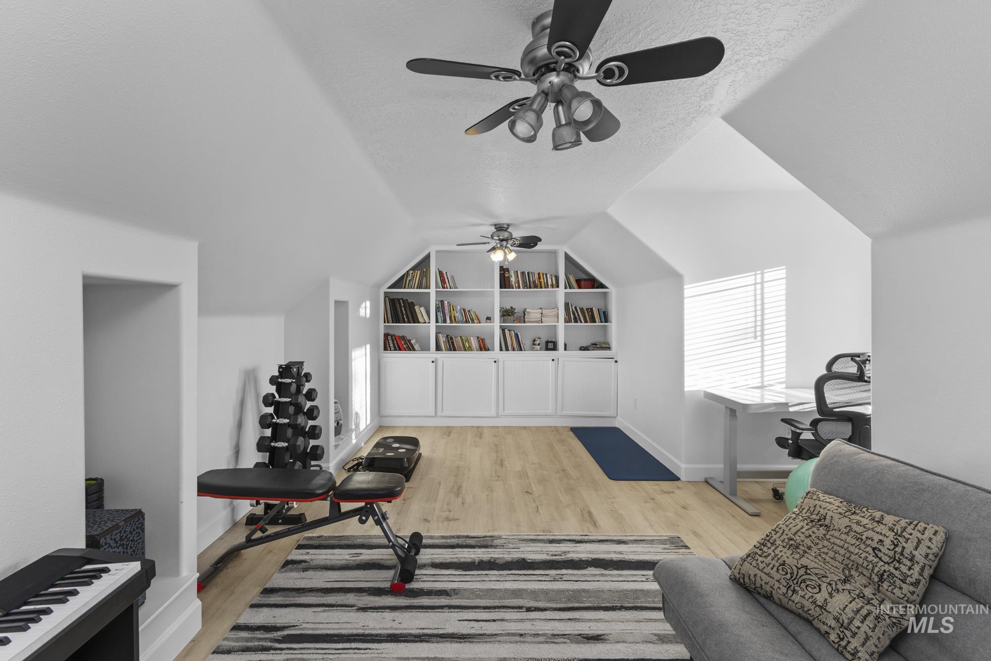 14820 Worden Way Caldwell, ID 83607 - Photo 36 of 44 Workout room with a ceiling fan and light wood-type flooring