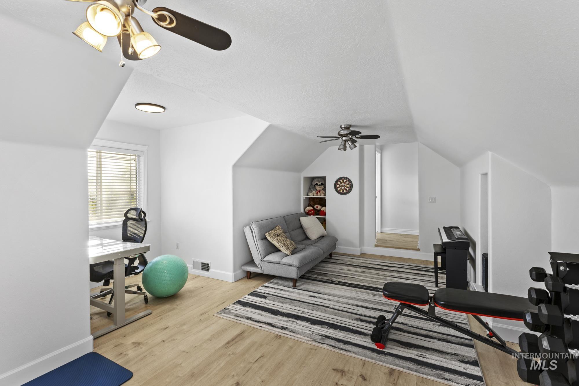 14820 Worden Way Caldwell, ID 83607 - Photo 37 of 44 Workout room with ceiling fan and light wood-style floors