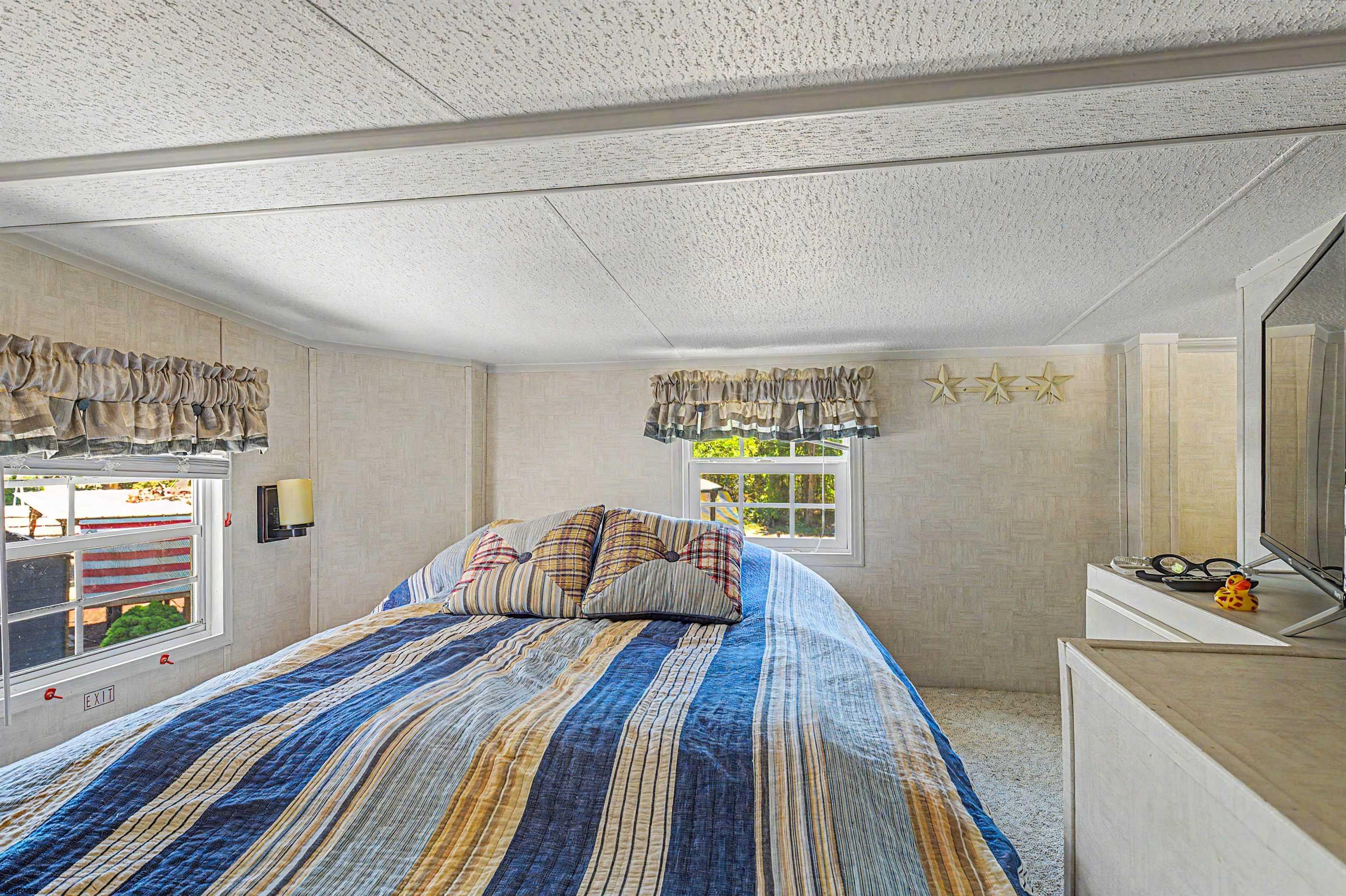 3066 Route 9 Ocean View, NJ 08230 - Photo 21 of 29 a bedroom with a bed and a window